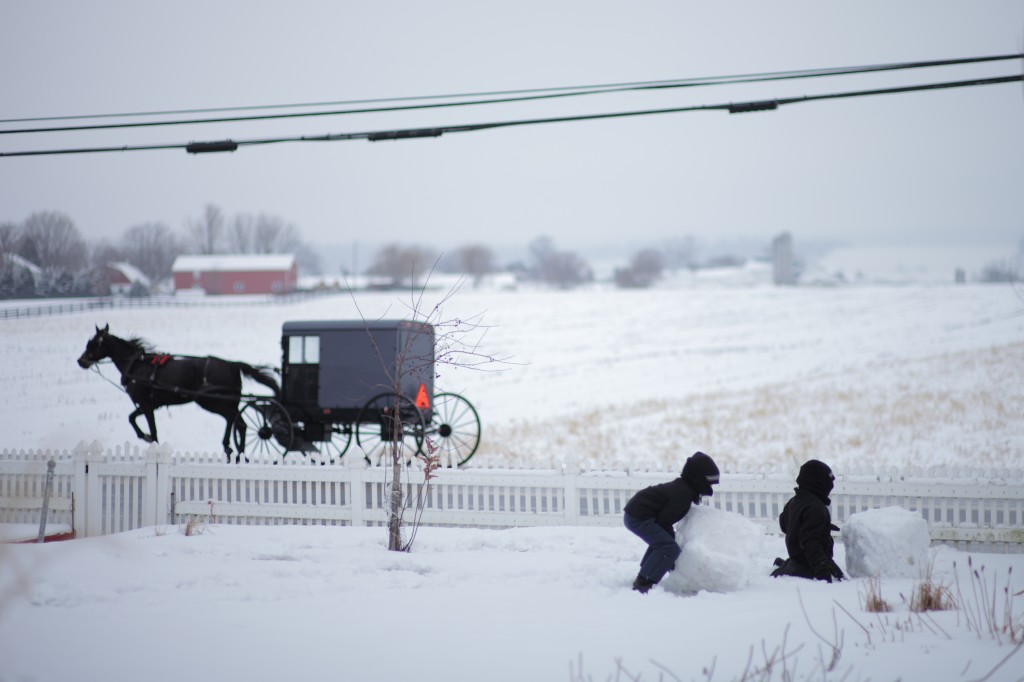 Amish Chidren Build Snowman
